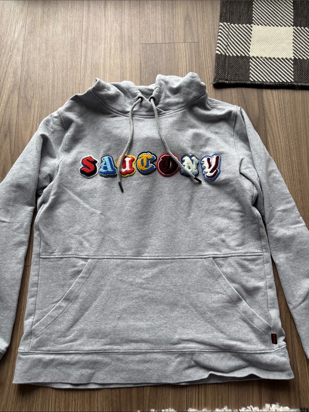 Women’s Large discontinued Saucony patch hoodie.